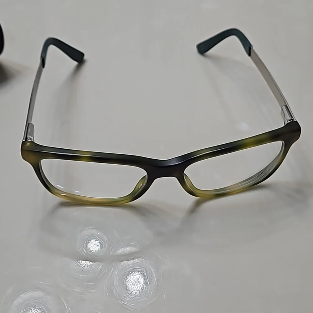 Tommy Hilfiger yellow and brown plastic frame glasses with case.